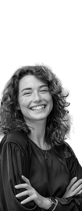 adult woman smiling with arms crossed